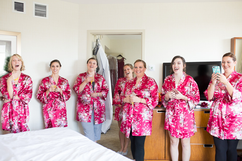 Bridesmaids laughing while watching the bride read her letter from the groom | Candid Wedding Photographer in Northern Virginia | Megan Rei Photography