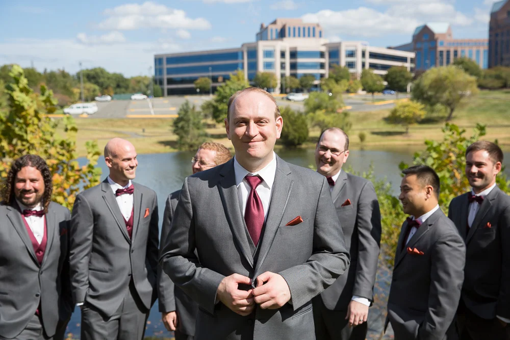 Groomsmen photo in front of the lake at the Westin Dulles Hotel