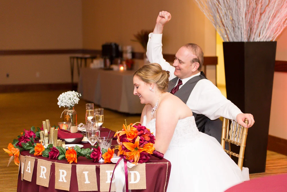 Candid photo of bride and groom while listening to the toasts | Northern Virginia Wedding Photography at the Westin Washington Dulles | Megan Rei Photography