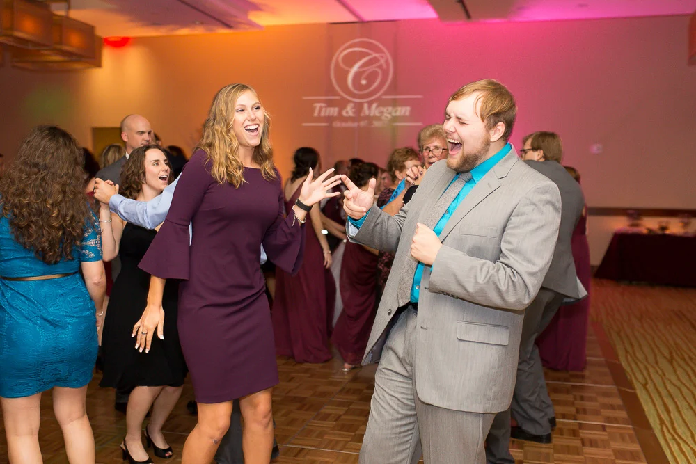 Candid dance floor picture of wedding guests at the Westin Washington Dulles Airport Hotel | Megan Rei Photography