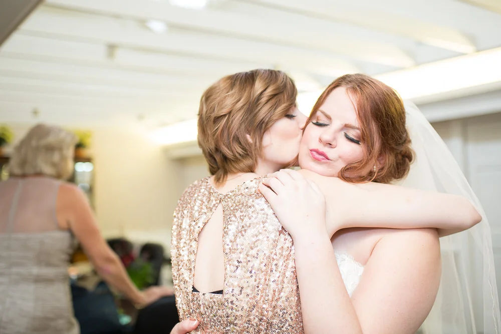 Sweet moment between bride and her sister | Candid Richmond Virginia Wedding Photographer