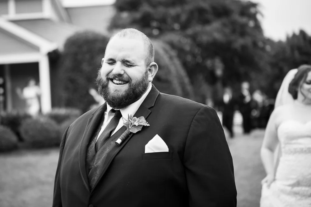 Smiling groom as he waits to see his bride for the first time | Documentary Wedding Photography in Richmond, Virginia