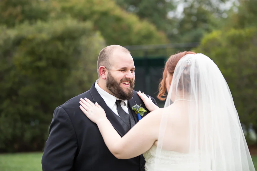 The First Look as bride and groom see each other for the first time at Fox Hall Clubhouse, Richmond