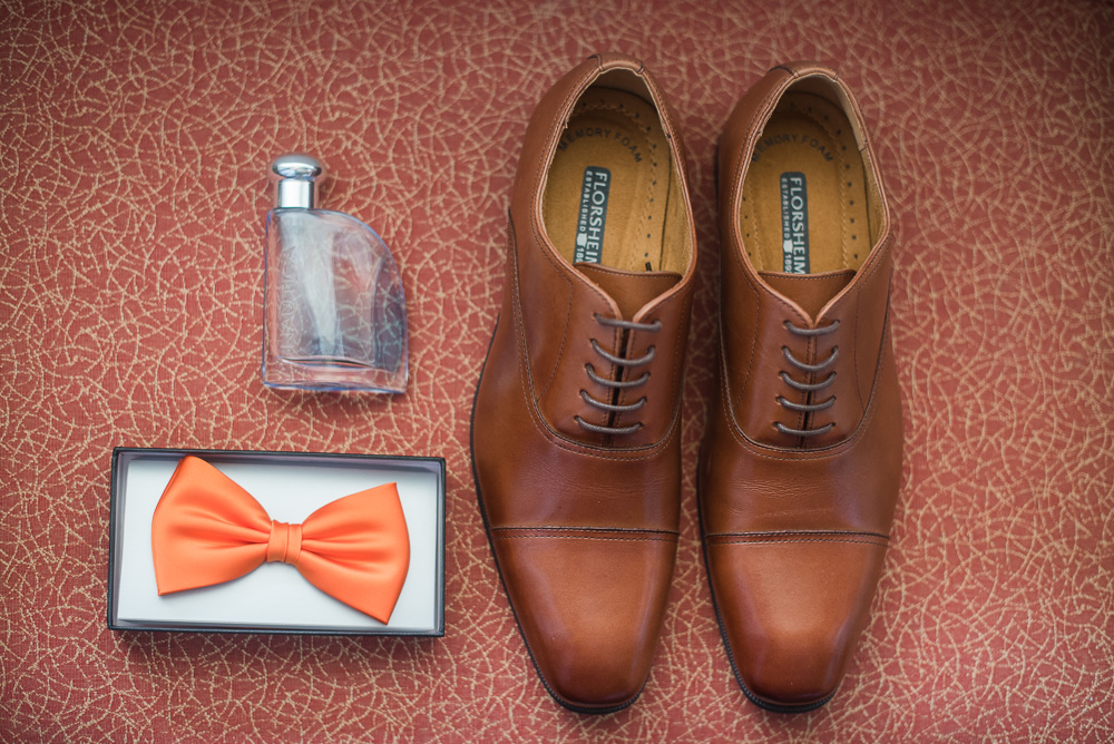 Groom’s details - shoes, bowtie, and cologne