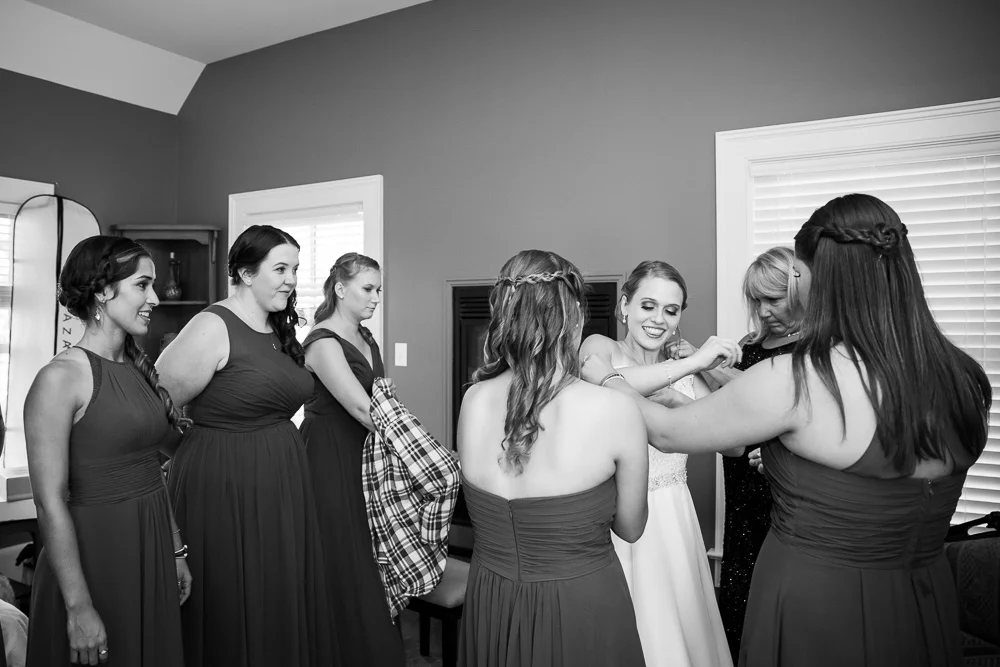 Putting on the wedding dress | Getting ready room at Mountain Run Winery | Documentary Wedding Photography