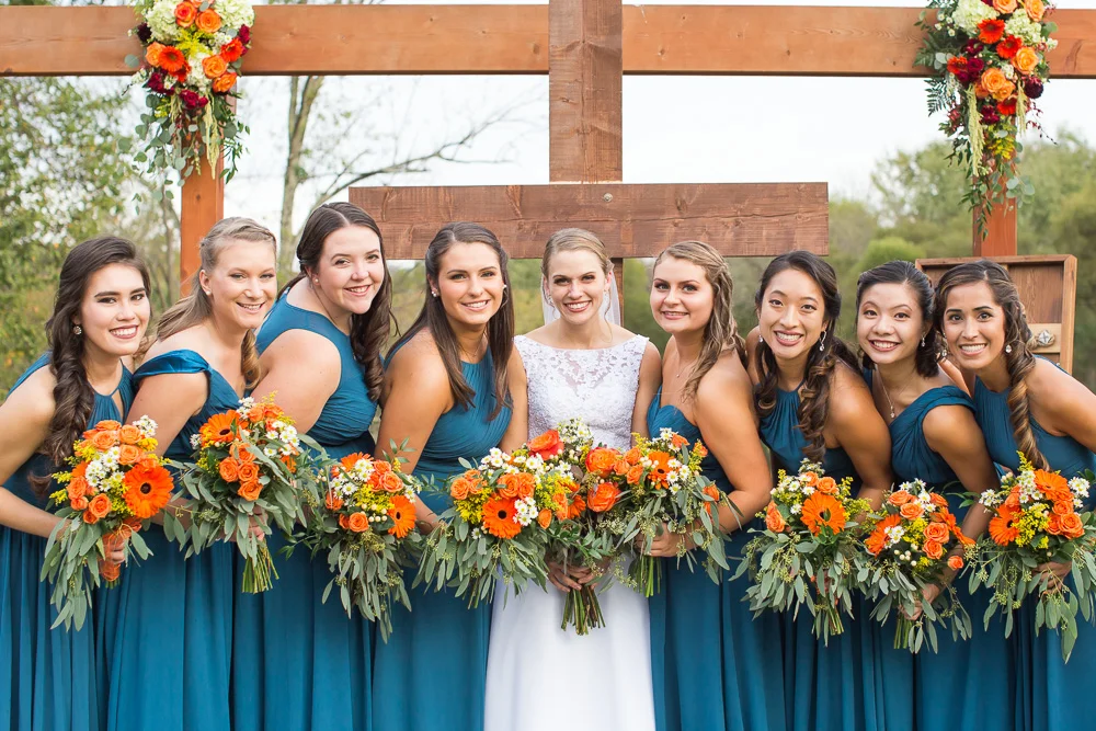 Bride and her bridesmaids | Teal and orange wedding colors
