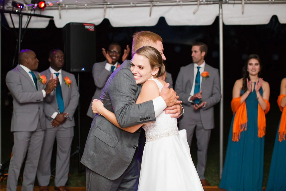Bride hugging her dad during the father-daughter dance at her wedding | Candid Wedding Photography in Culpeper, VA