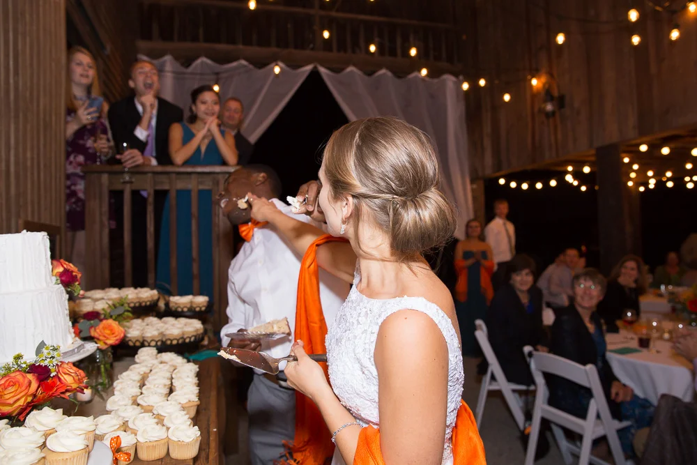Cutting the wedding cake from Eloise’s Pastries | Barn Wedding in Culpeper, Virginia