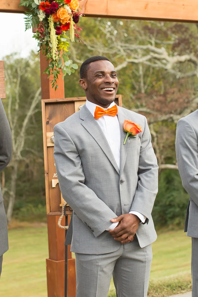 Candid photo of groom's reaction to seeing the bride for the first time | Mountain Run Winery Wedding in Culpeper, Virginia