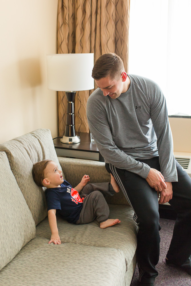 Groom hanging out with the ring bearer