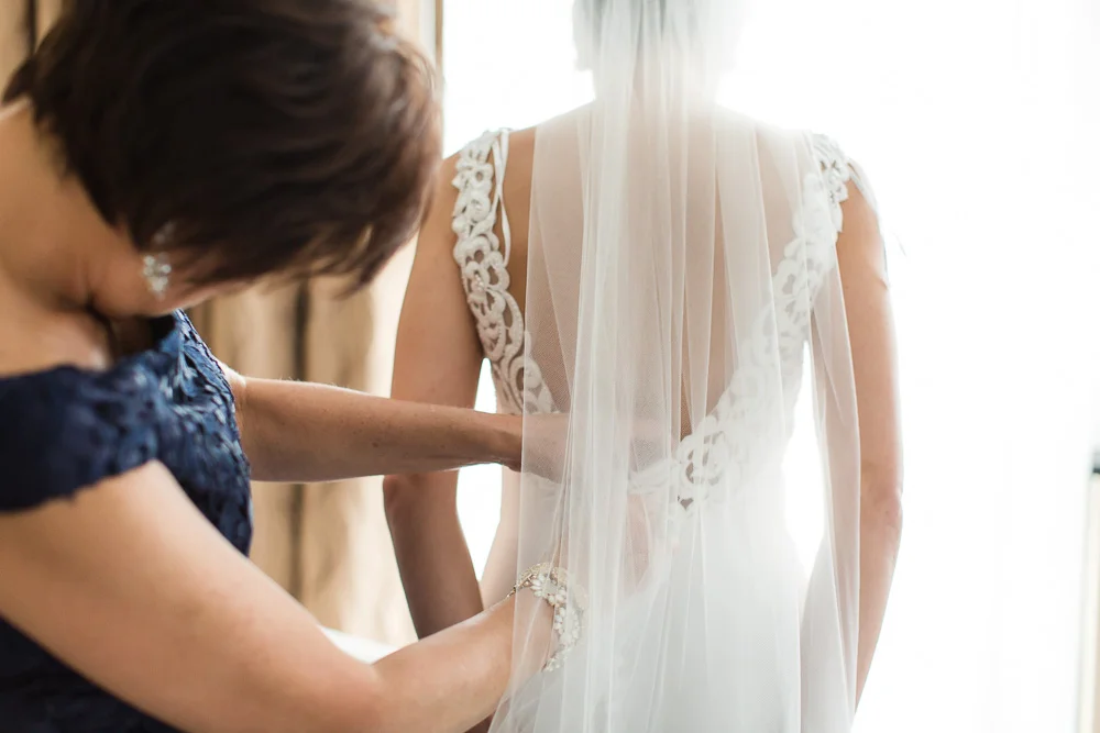 Bride putting on her wedding dress | Megan Rei Photography | Rochester NY Photographer