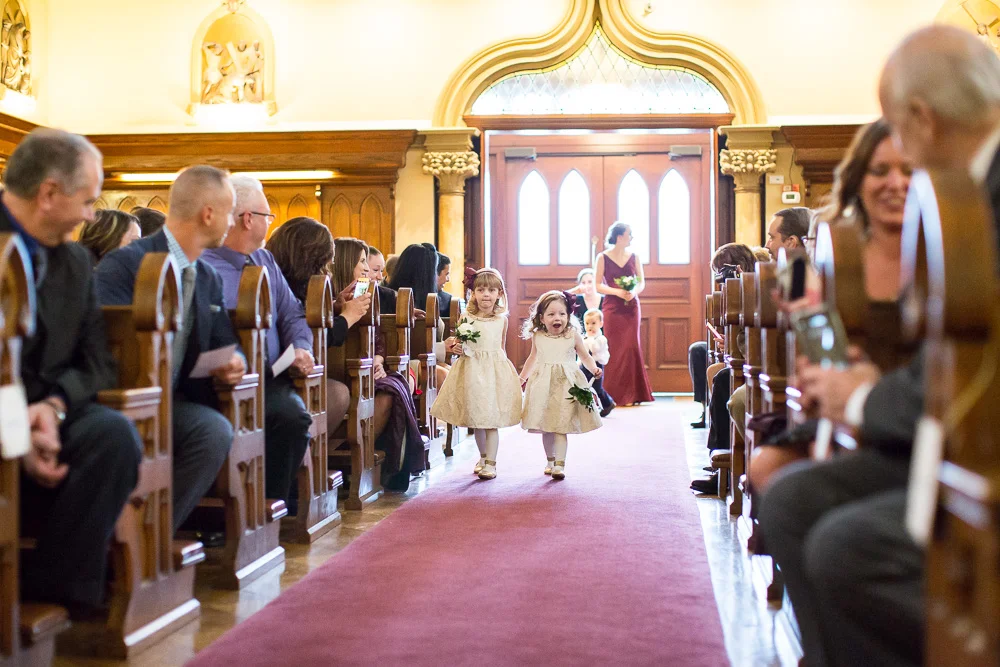 Flower girls coming down the aisle at Chapel Hill | Rochester NY Wedding Venue