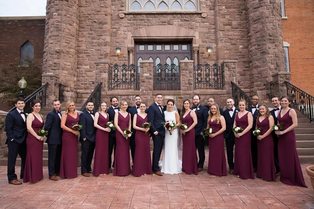 Full wedding party photo in of the church | Chapel Hill Wedding Photography | Navy and burgundy bridal party