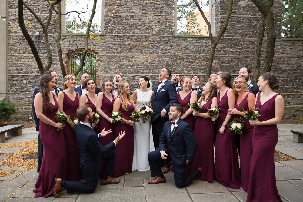 Wedding party having fun at St. Joseph’s Park | Wedding photo locations in Rochester, NY | Navy and Maroon Wedding | Megan Rei Photography