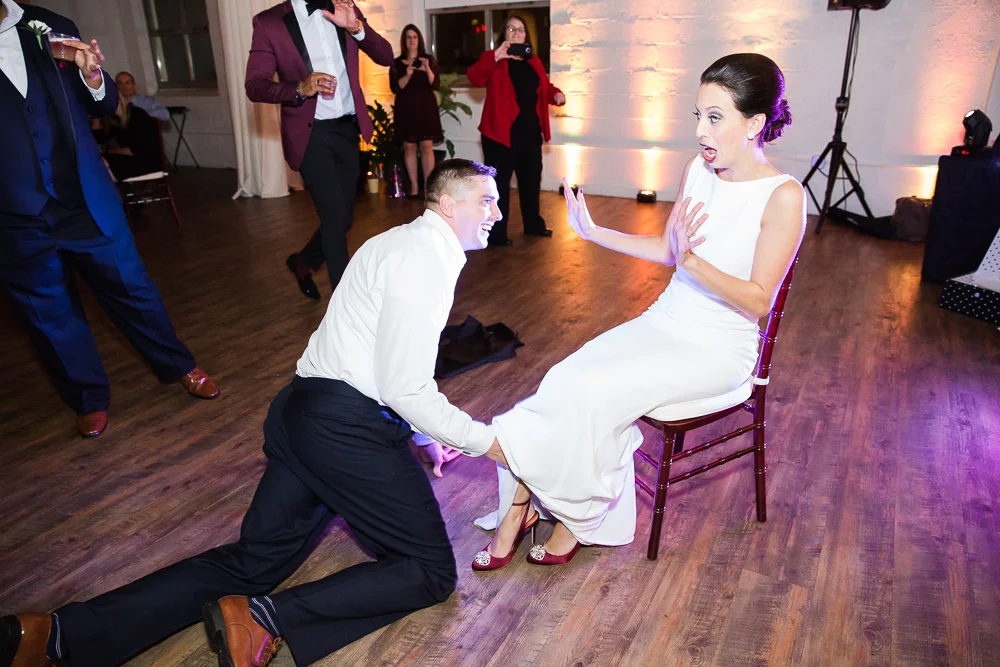 Funny garter removal at Rochester NY Wedding