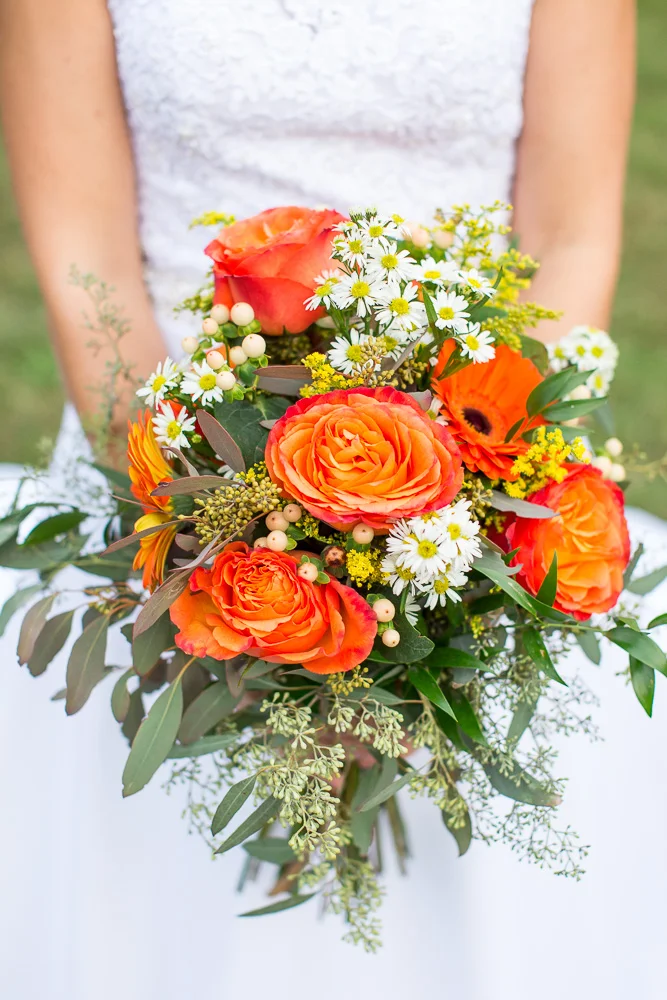 Beautiful orange wedding bouquet by Melanie’s Florist | Northern Virginia Florist