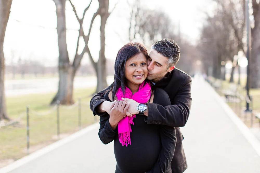 Sweet moment between husband and wife during their DC maternity session | Washington DC Candid Photographer