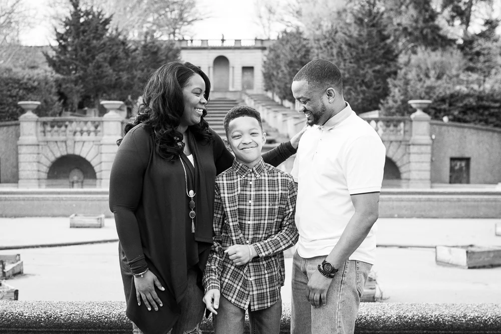 Laughing together in front of the steps and fountain