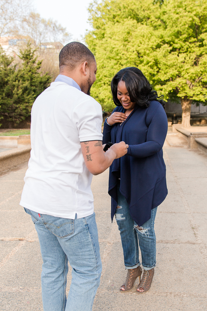 Putting on the engagement ring after the proposal | Washington DC Proposal Photography | Best DC locations for wedding proposal