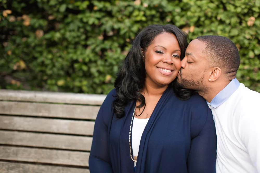 Giving his future bride a kiss on the cheek after the proposal | Washington DC Proposal Photos at Meridian Hill Park