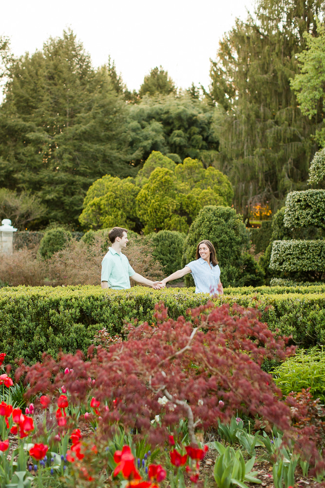 Holding hands while walking through the gardens