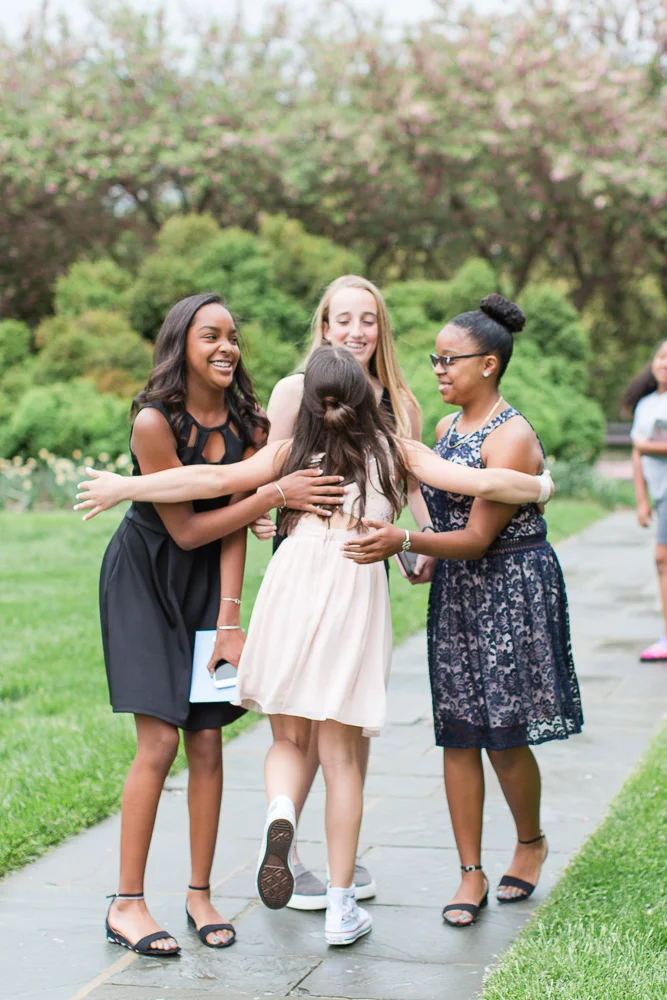 Giving a big hug to her friends as they arrive at Glenview Mansion | Rockville, MD Candid Photographer