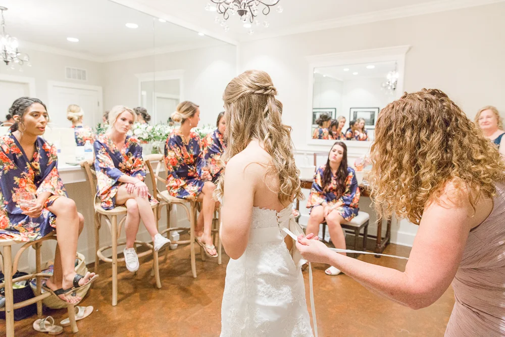 Putting on the wedding dress | Candid Charlottesville Wedding Photographer
