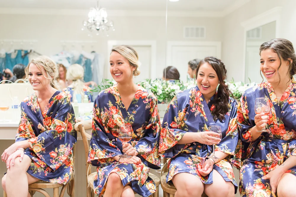 Laughing bridesmaids while getting ready for the wedding day | Charlottesville candid wedding photography | Megan Rei Photography
