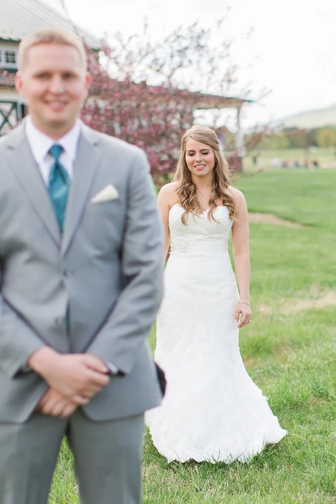 Bride walking up to the groom for their First Look photos at King Family Vineyards | Best Charlottesville Wedding Venue