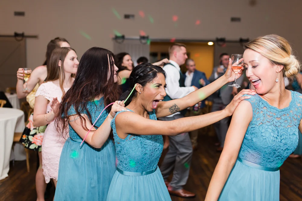 Bridesmaid having fun on the dance floor at King Family Vineyards | King Family Vineyards reception pictures