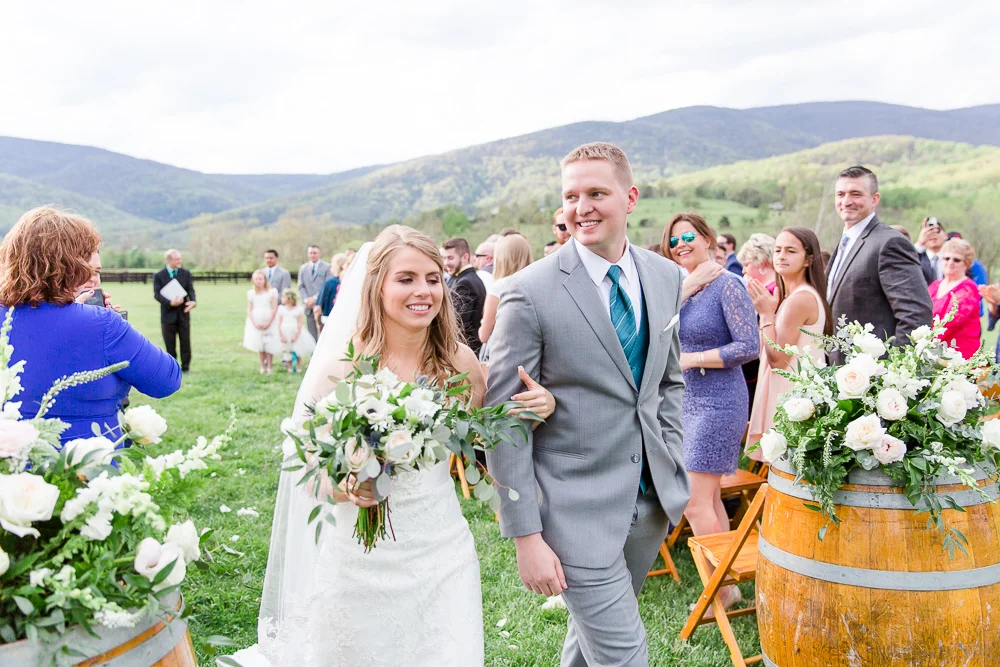 Bride and groom recessional after the ceremony | King Family Vineyards wedding venue in Crozet, VA