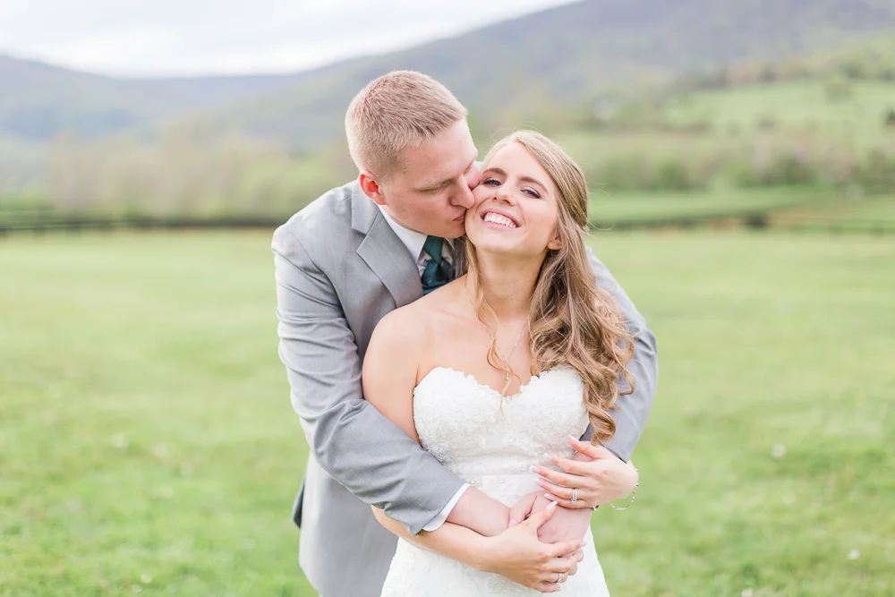 Sweet picture of groom giving the bride a kiss | King Family Vineyards Wedding Pictures | Crozet Wedding Venue