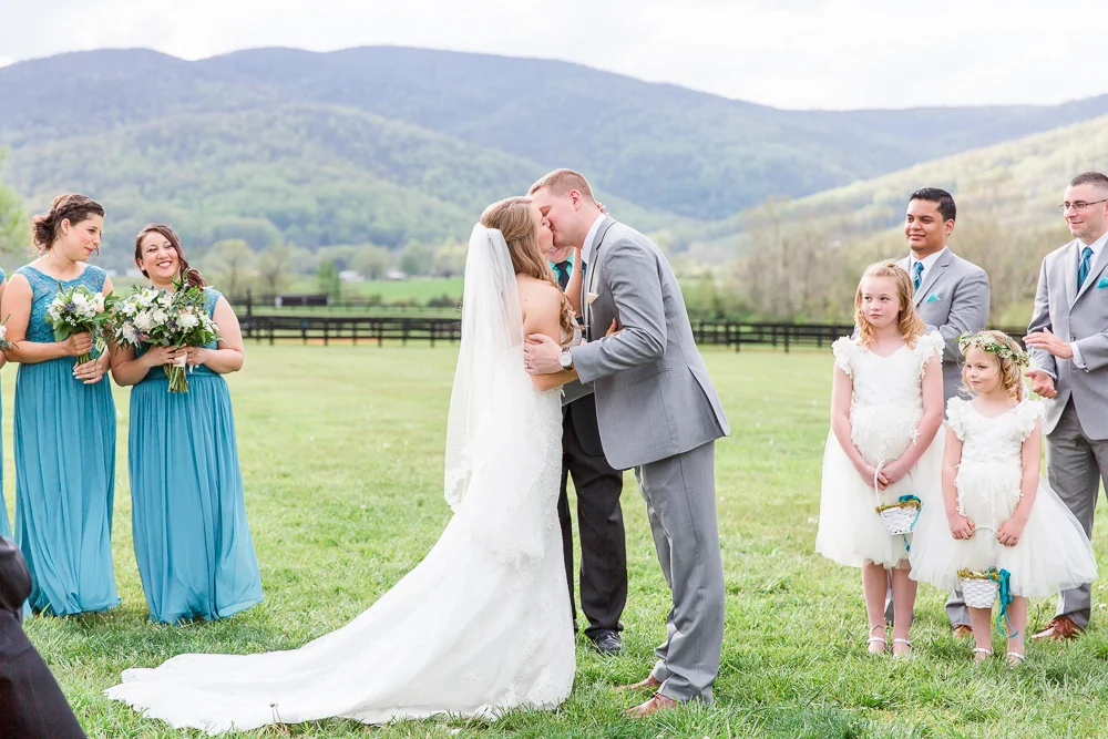 The first kiss during the wedding ceremony at King Family Vineyards | Blue Ridge Mountain wedding venue