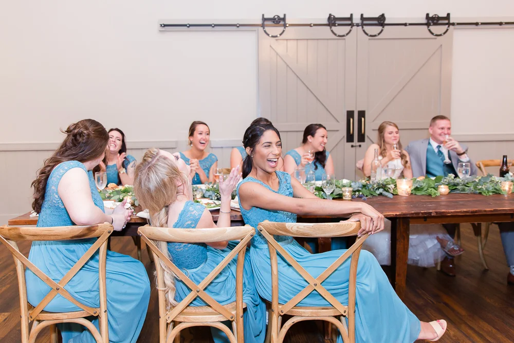 Wedding party laughter during the toasts