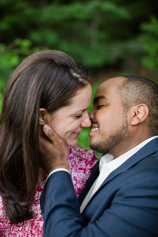 Leaning in for a kiss during their engagement session