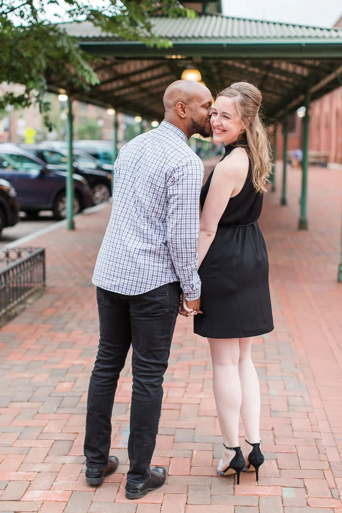 Giving his fiance a kiss on the cheek