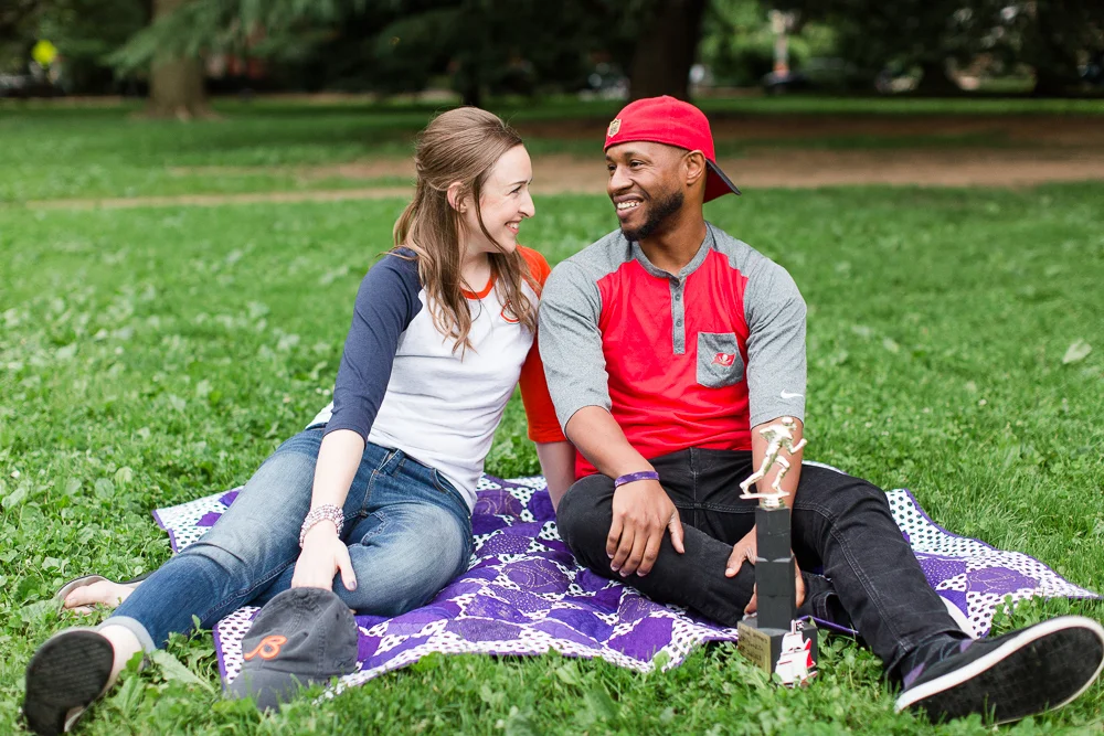 Sitting on a blanket during engagement pictures at Lincoln Park in Washington, DC