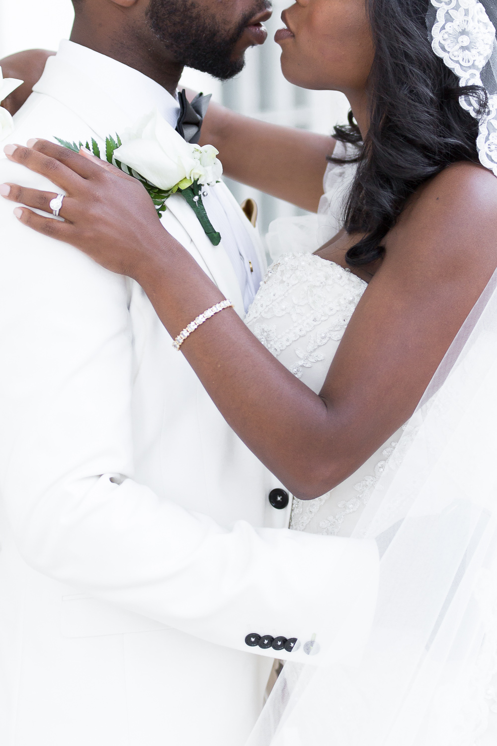 Bride and groom lean in for a kiss