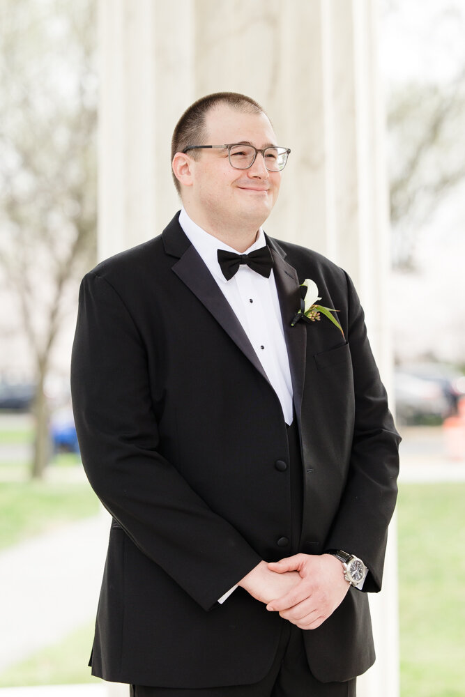 Smiling groom during wedding ceremony