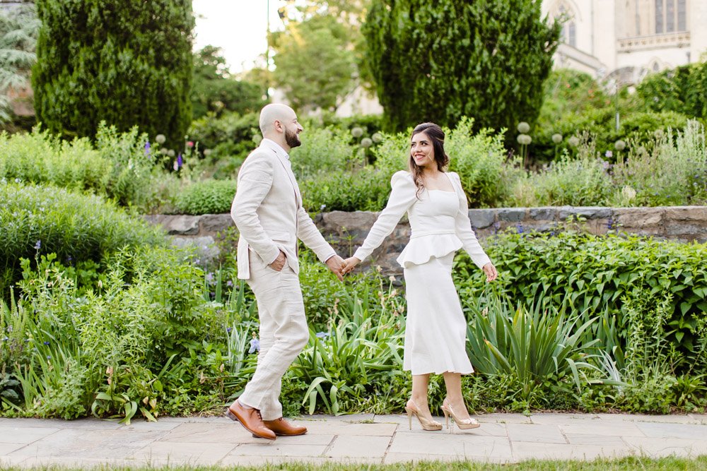  National Cathedral elopement couple walking in the garden 