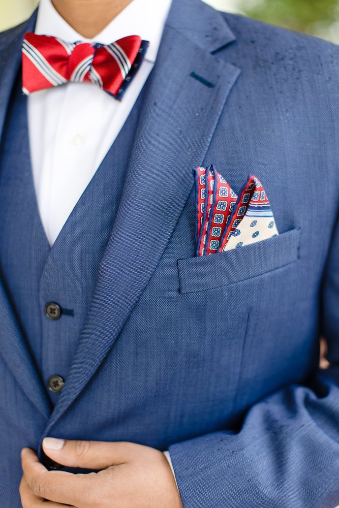 Groom's red, white, and blue tie and pocket square