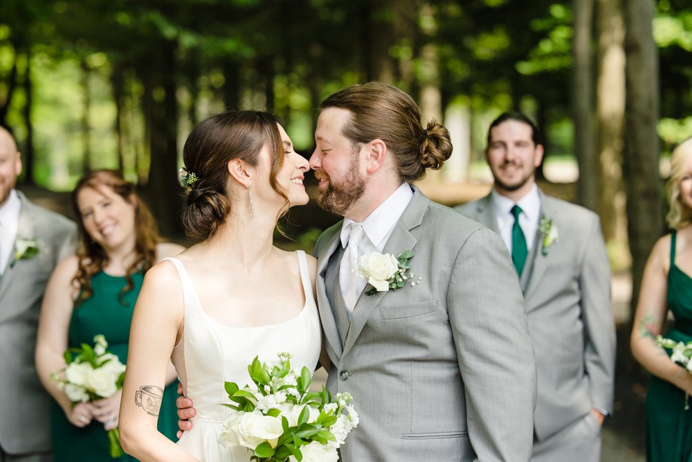 Bride and groom kissing before the wedding ceremony