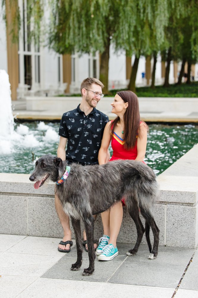Couple and their dog by the fountain at the Kennedy Center