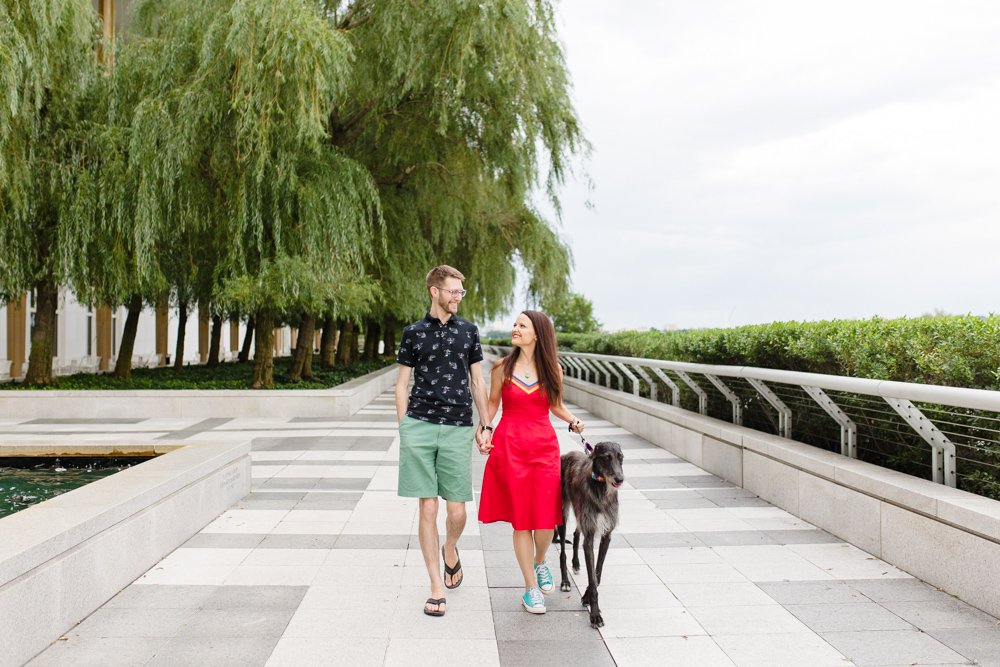 Couple walking their dog on the patio at the Kennedy Center