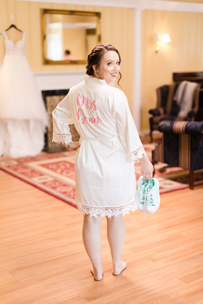 Bride getting ready in white robe