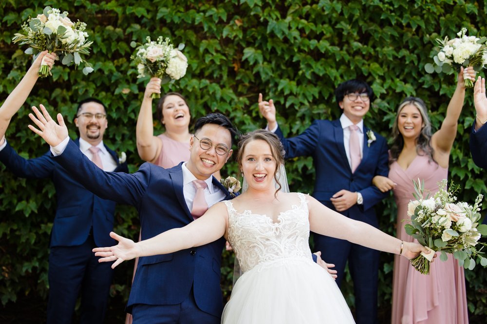 Fun photo of bride and groom with bridal party