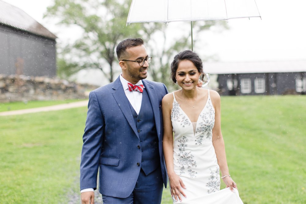 Wedding couple on rainy day at Shawnee Farms Estate