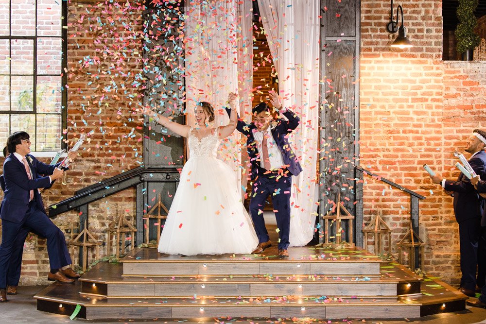 Bride and groom enter the wedding reception at the Inn at Old Silk Mill