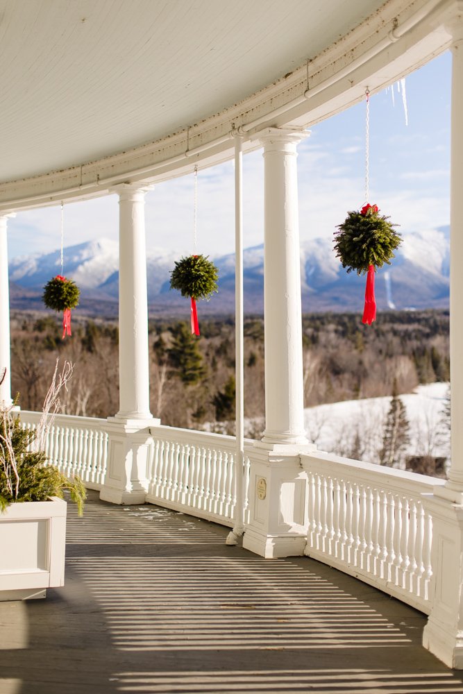 Christmas decor on the covered porch at the Omni Mount Washington Resort
