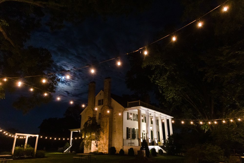 Night photo of the manor house at Effingham Manor Winery